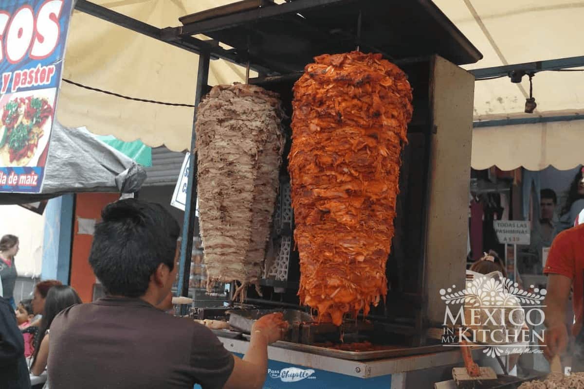 Al pastor tacos made at a taco stand in Mexico