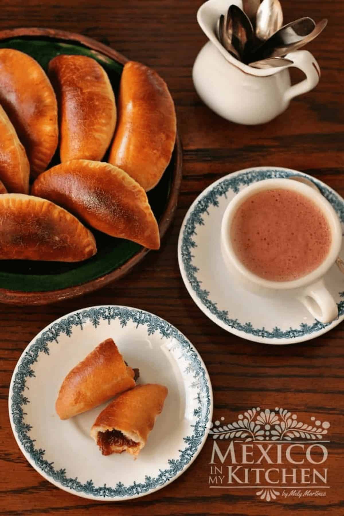Empanadas with pumpkin filling served with a hot chocolate.