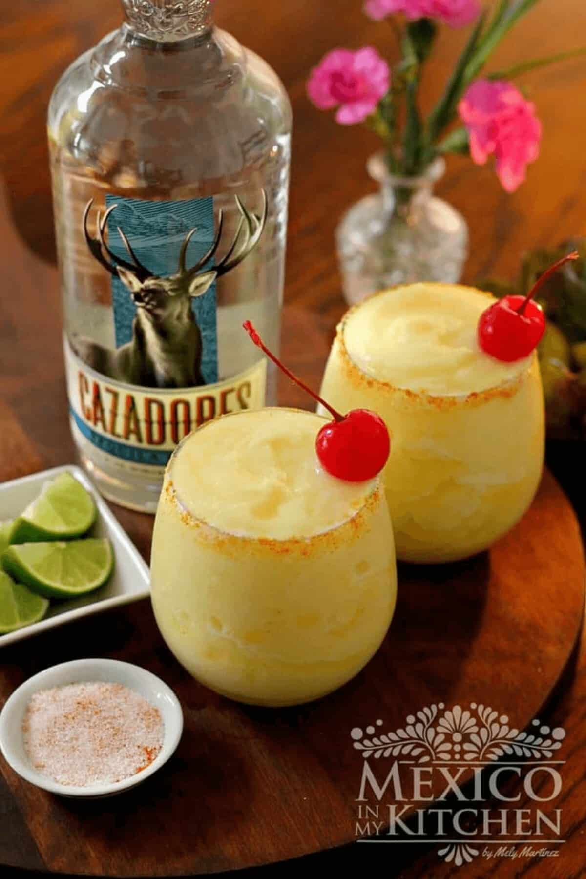 Pineapple margaritas serve with garnishes