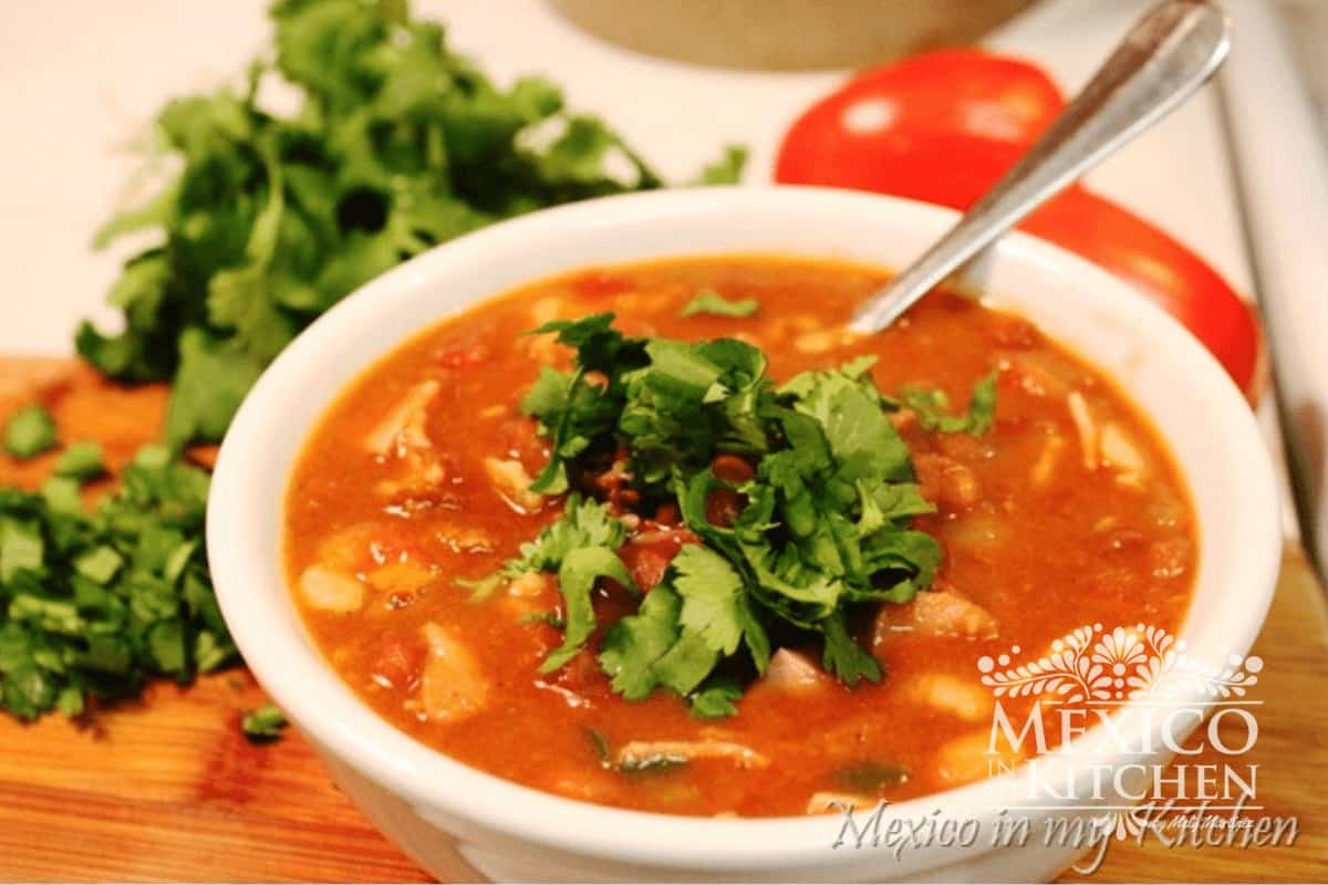 Bowl of Mexican bean soup topped with cilantro