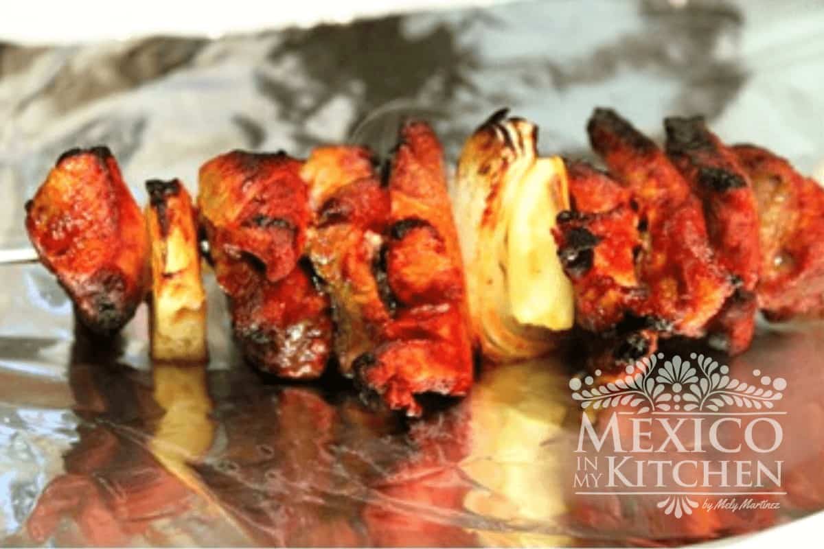Pork meat marinaded with pineapple chunks cooked on your broiler.