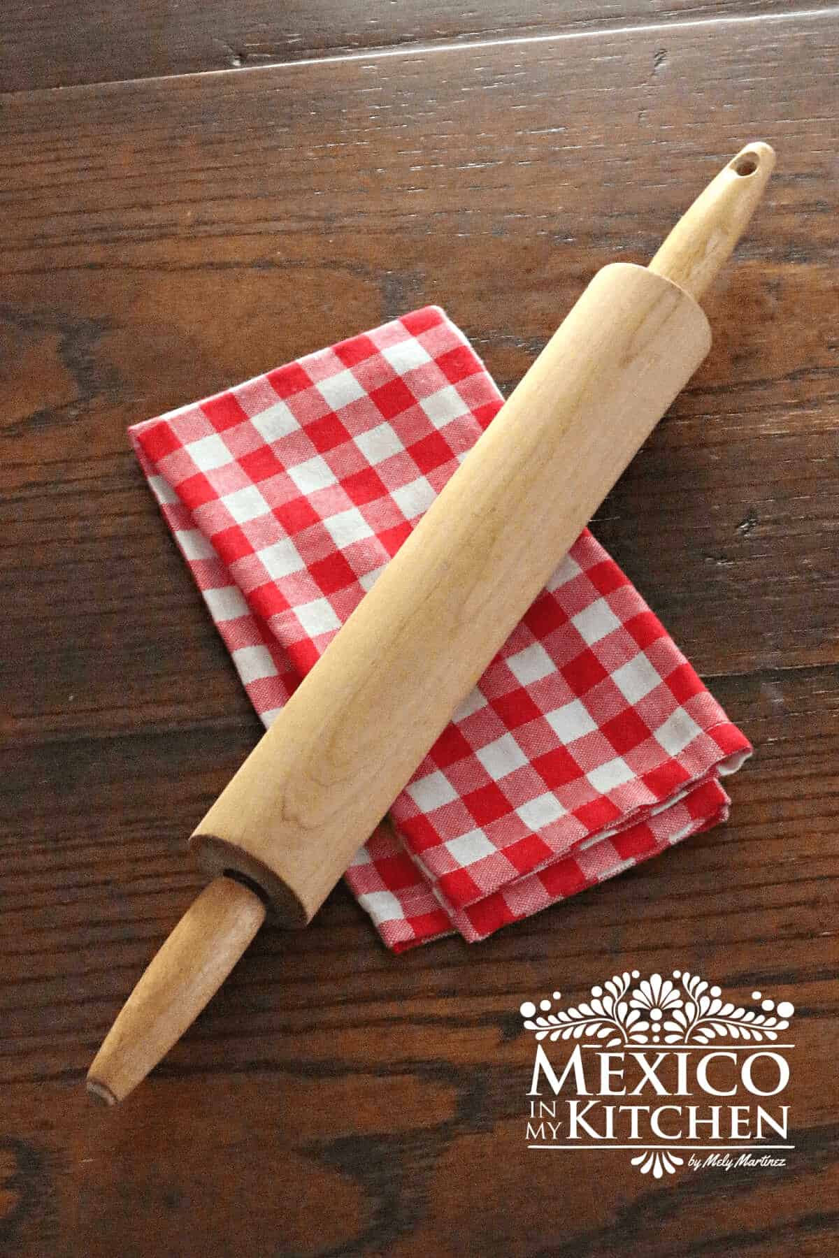Mexican rolling pins on a cloth napkin.