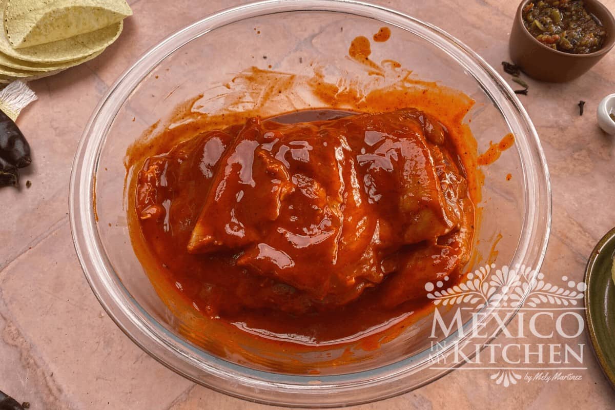 Pork meat marinated in an adobo sauce for tacos al pastor. 