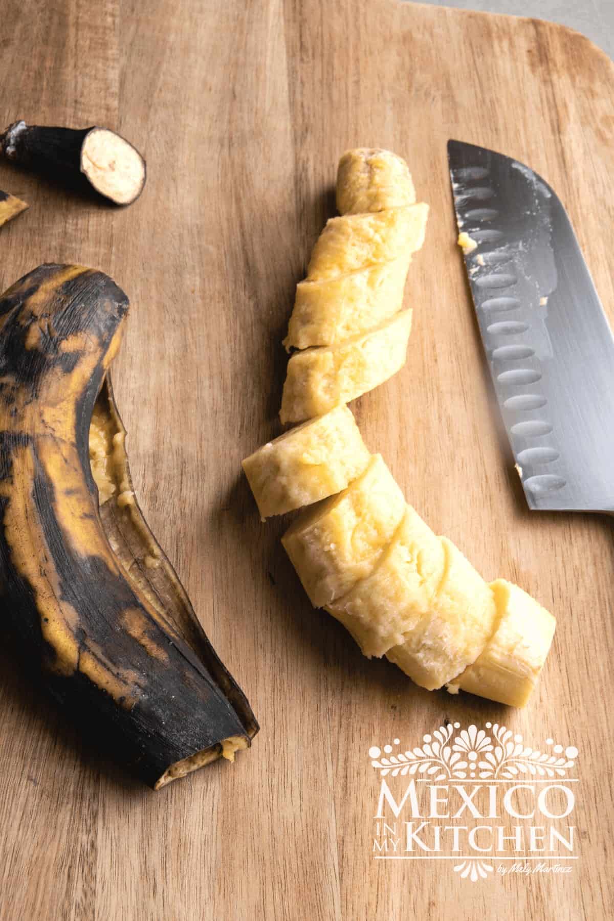 Sliced plantain on a cutting board