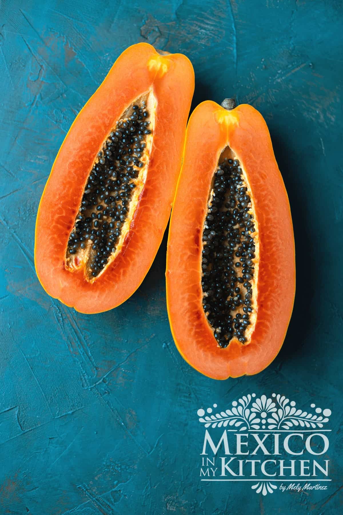 Fresh Papaya slice in half.