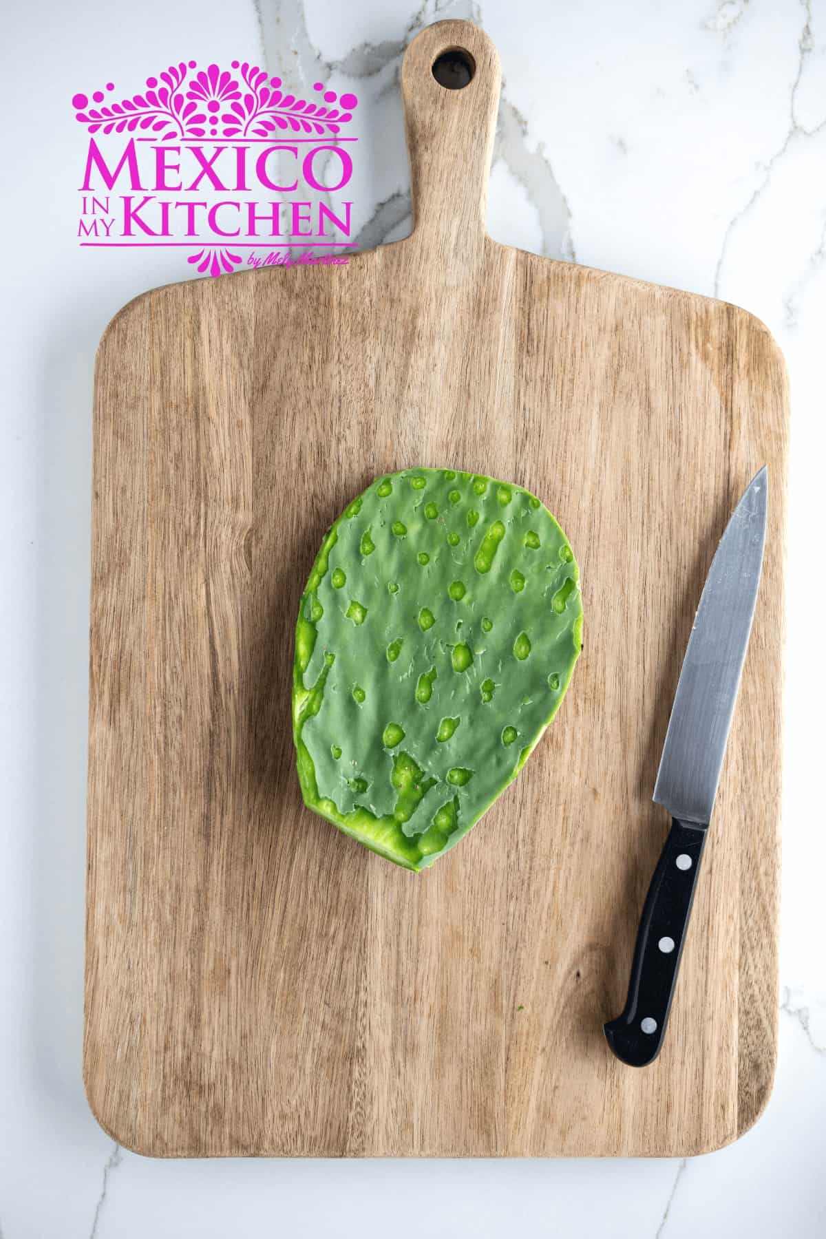 Cactus paddles on a cutting board without the thorns.