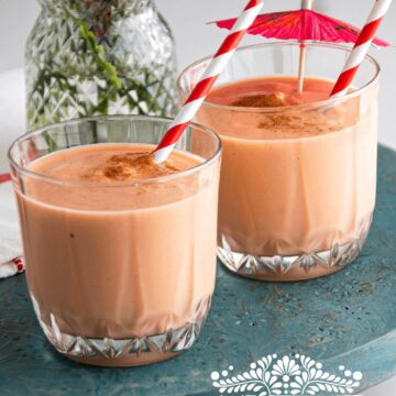 Two cups of Mamey smoothie with straws