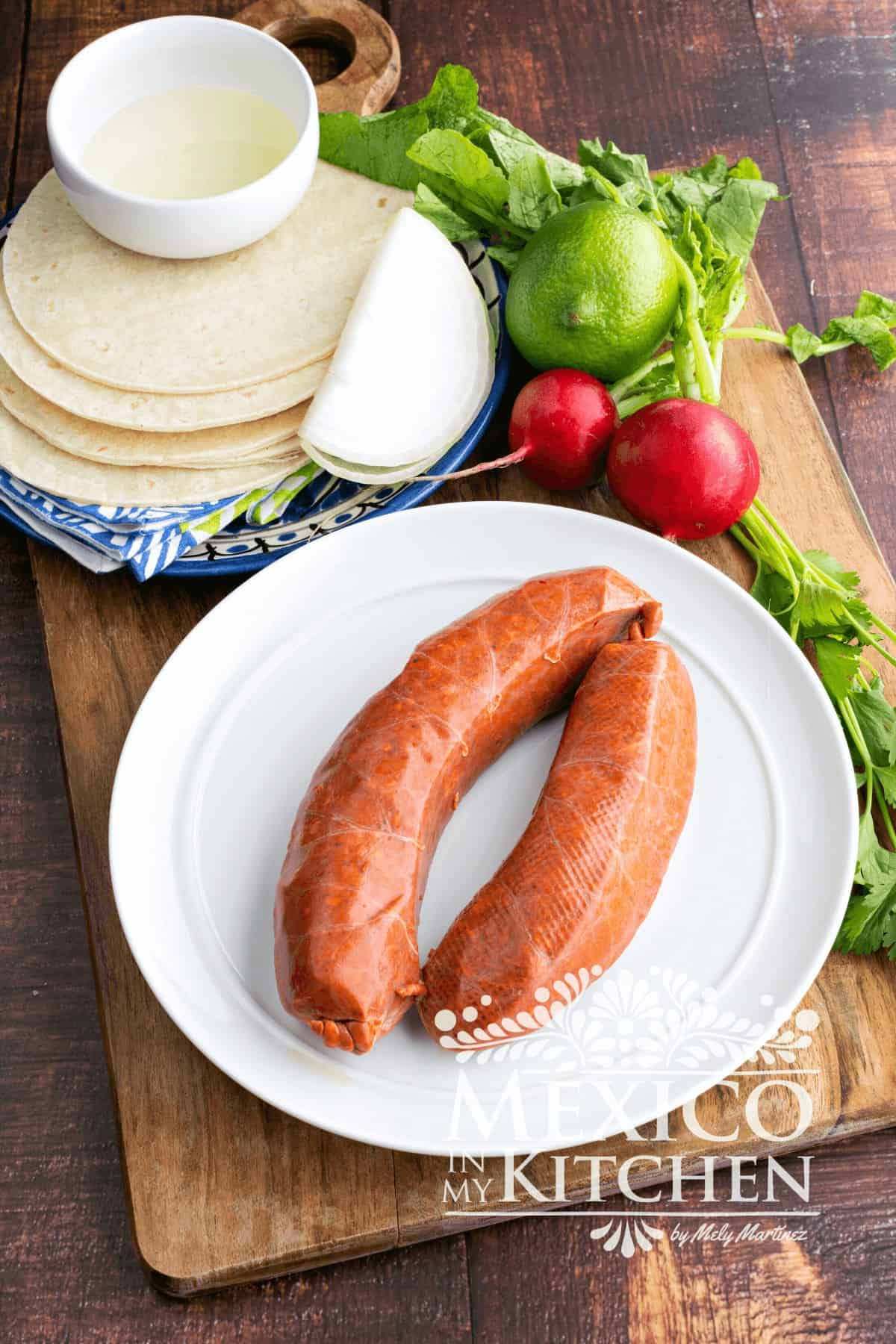 Mexican Sausage links on a white plate.