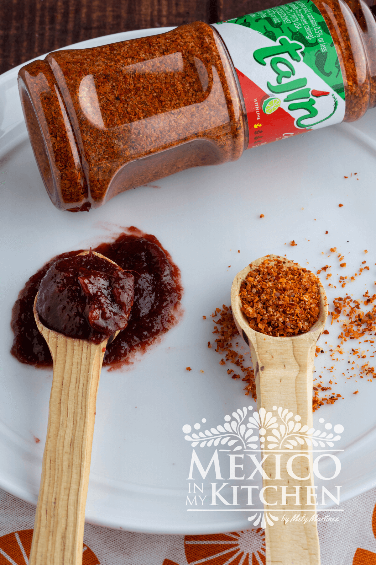 Homemade chamoy in a spoon next to a spoon of tajin powder