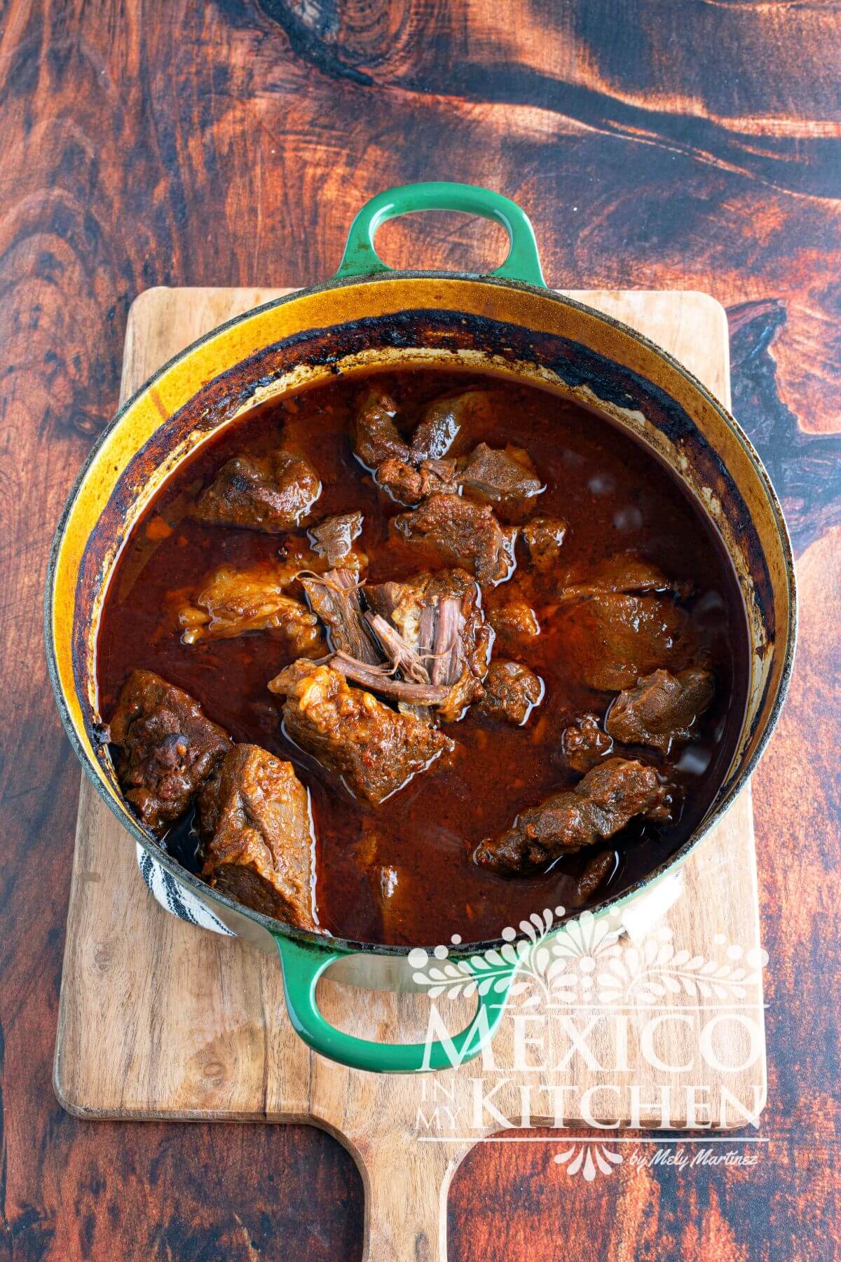Cooked birria in a cast iron pot