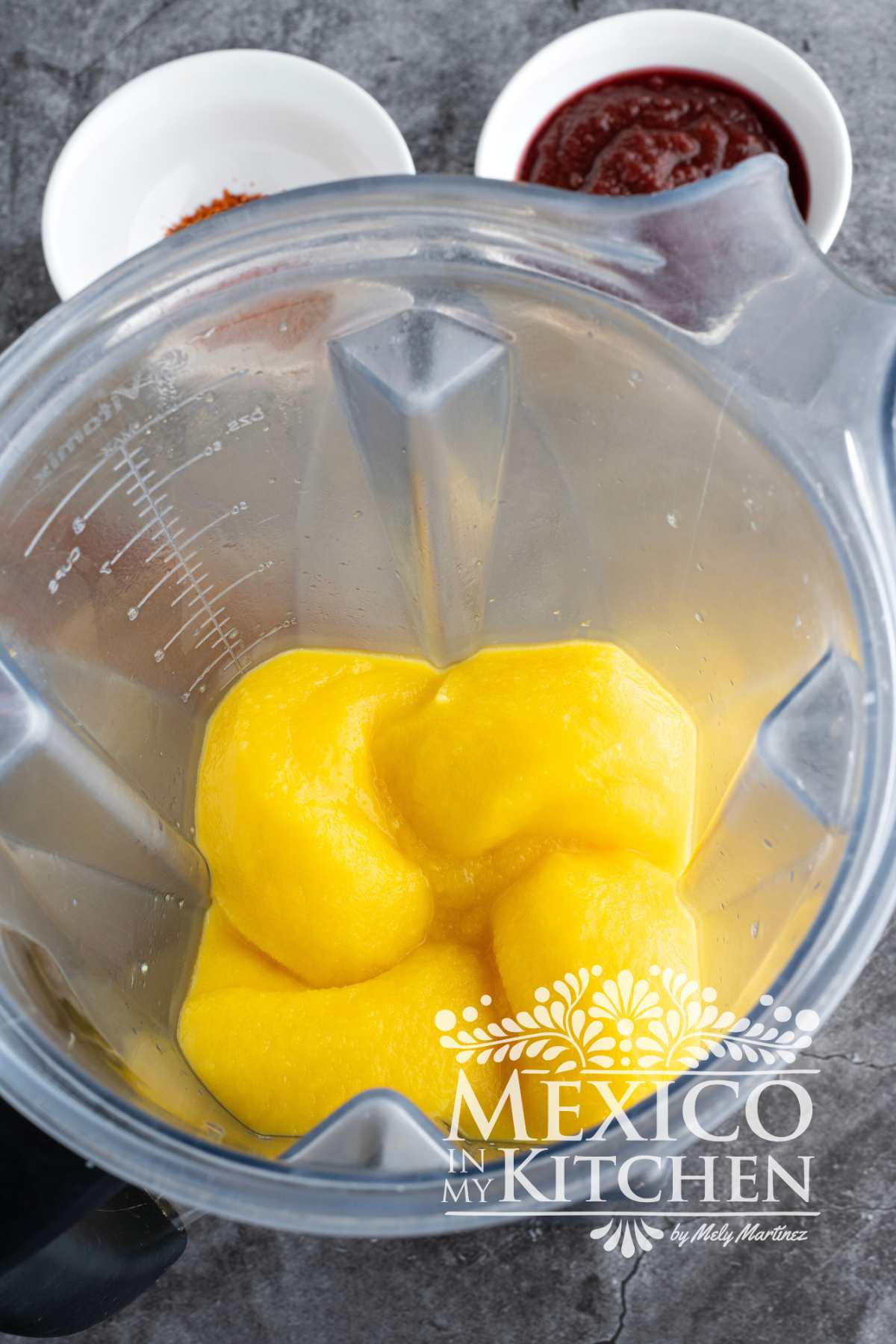 Mango mixture in a blender, looking smooth and creamy.