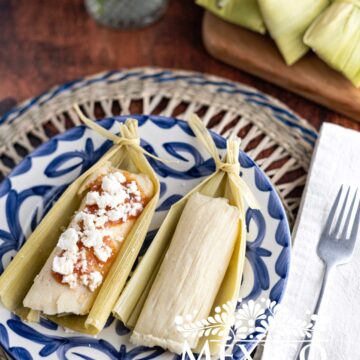 Sweet Corn Tamales topped with salsa and queso fresco.