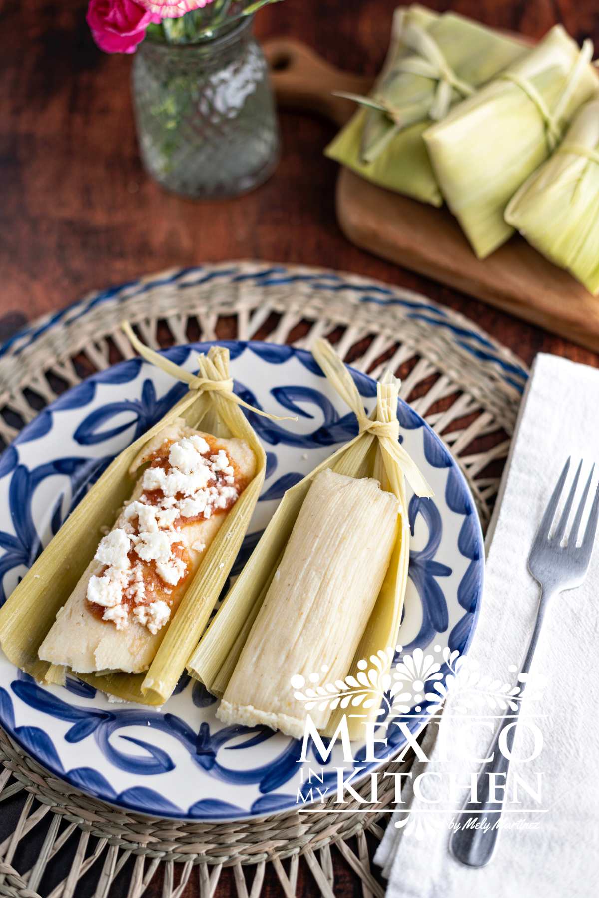 Sweet Corn Tamales topped with salsa and queso fresco.