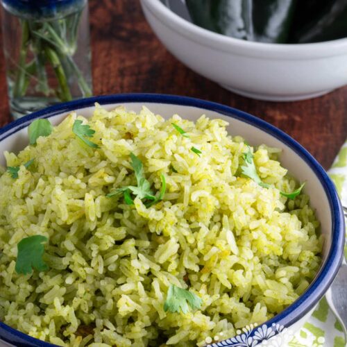 Green rice | arroz verde served in a bowl and topped with cilantro.