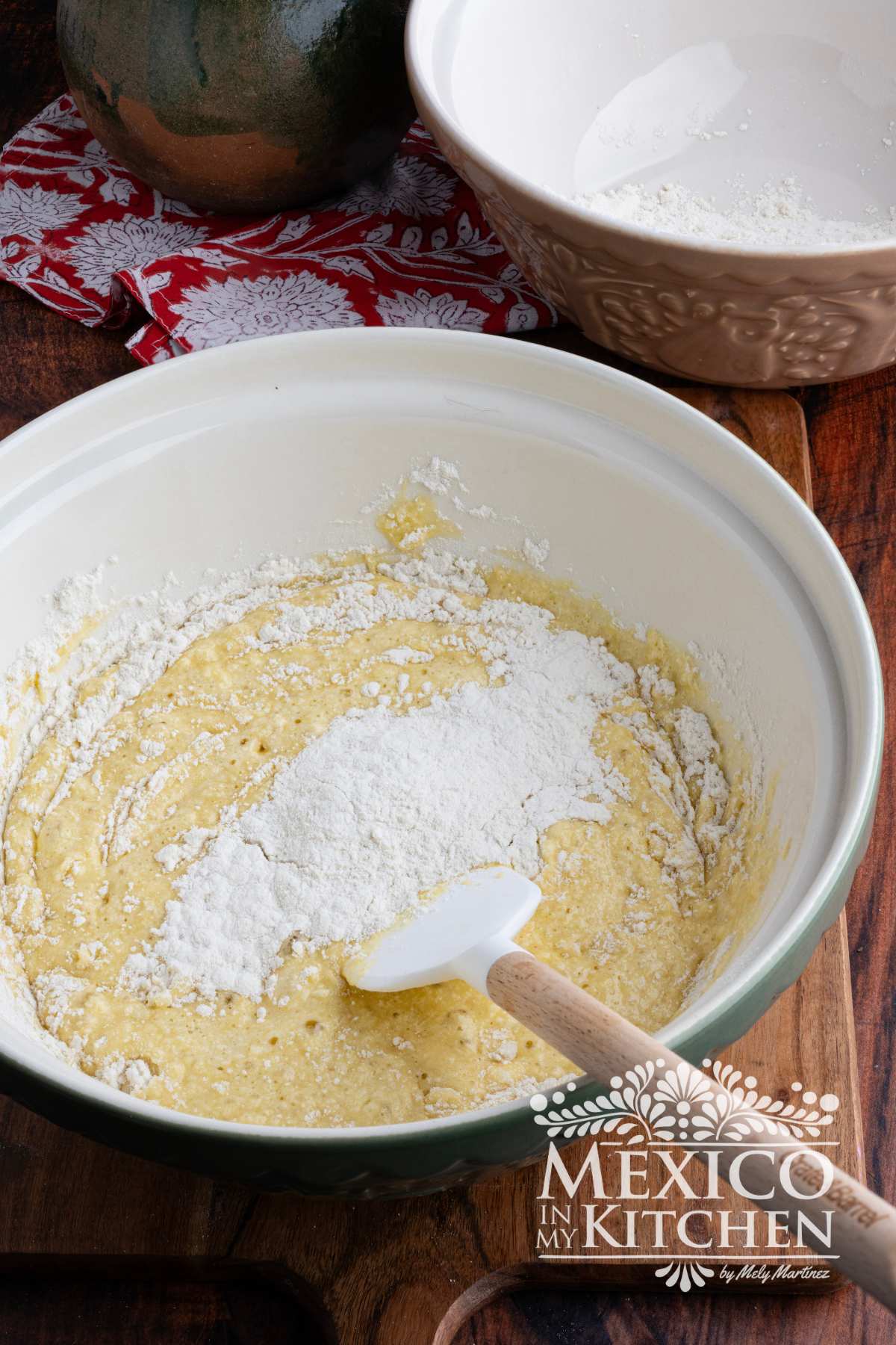 Mixture of eggs and flour in a mixing bowl.