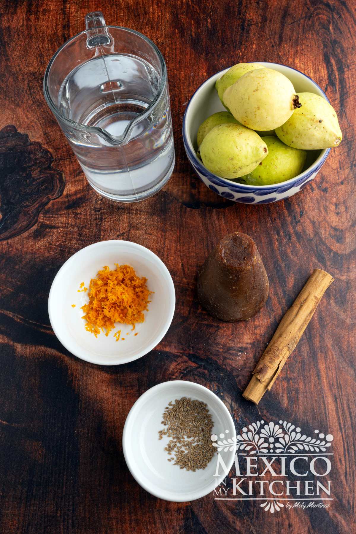 Ingredients like water, guavas, orange zest, piloncillo, cinnamon stick and anise seeds.