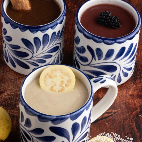 Mugs with Mexican Atoles (Champurrado, guava, and blackberry)