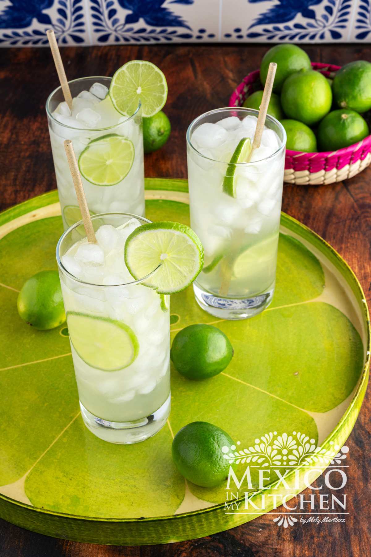 Agua de limón Recipe (Lime Agua Fresca) serve in tall glasses and garnish with slices of limes.