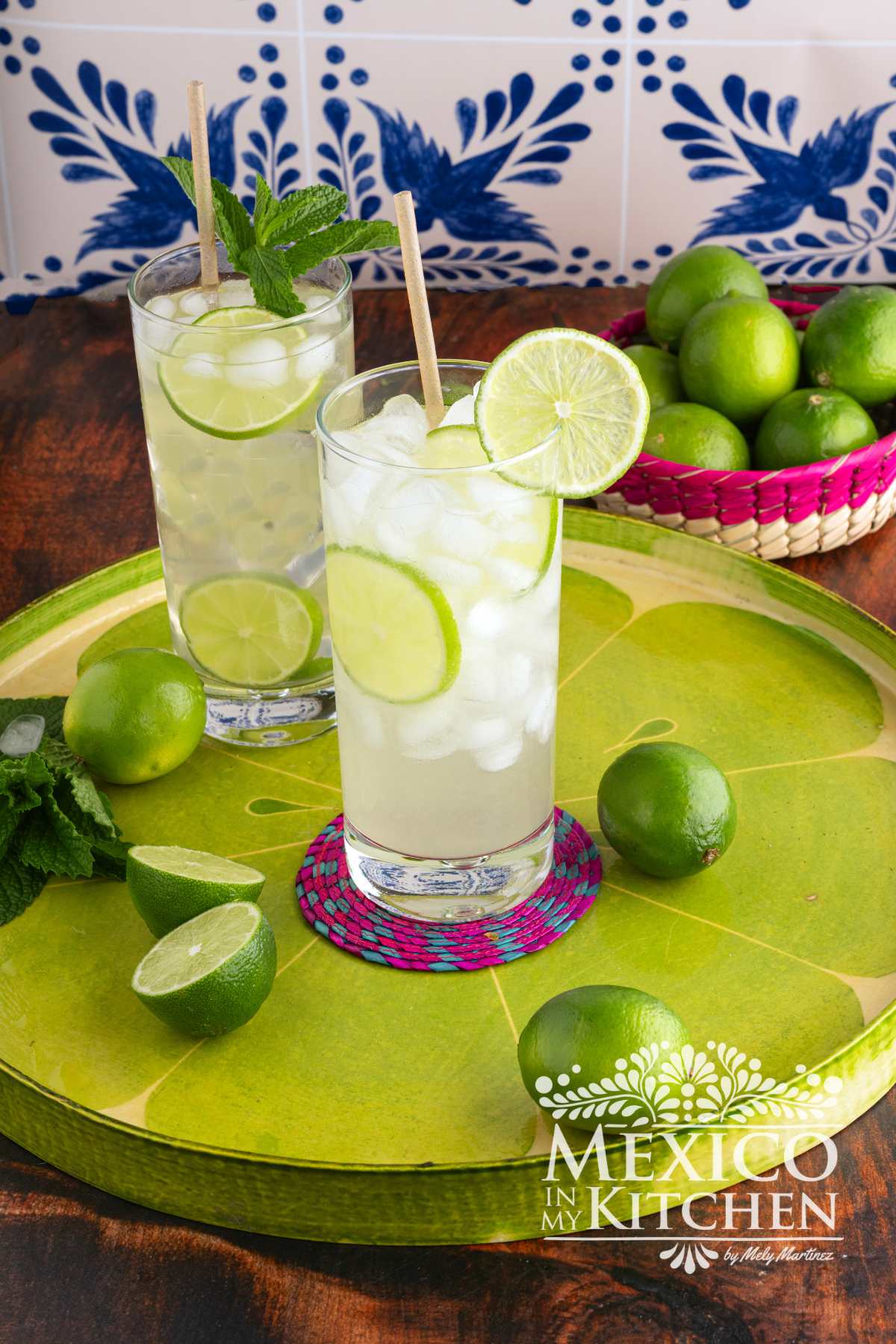 Agua de limón Recipe (Lime Agua Fresca) serve in tall glasses and garnish with slices of limes.