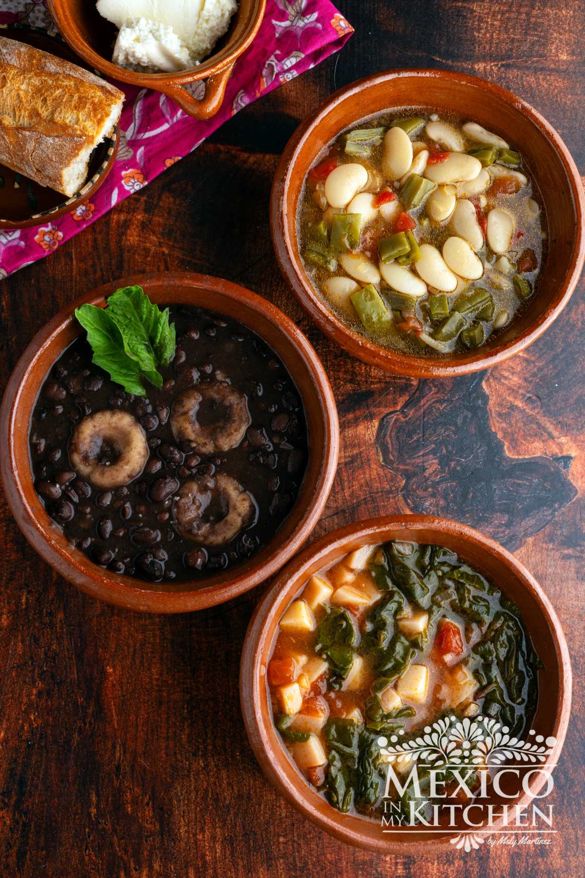 Collection of Mexican soups served in clay bowls.