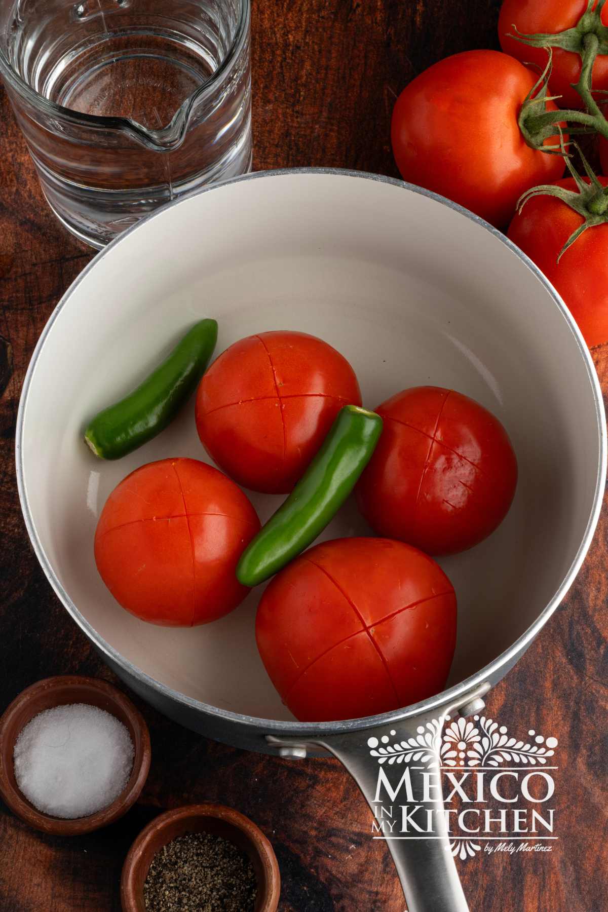 Tomatoes, and serranos in a sauce pan.