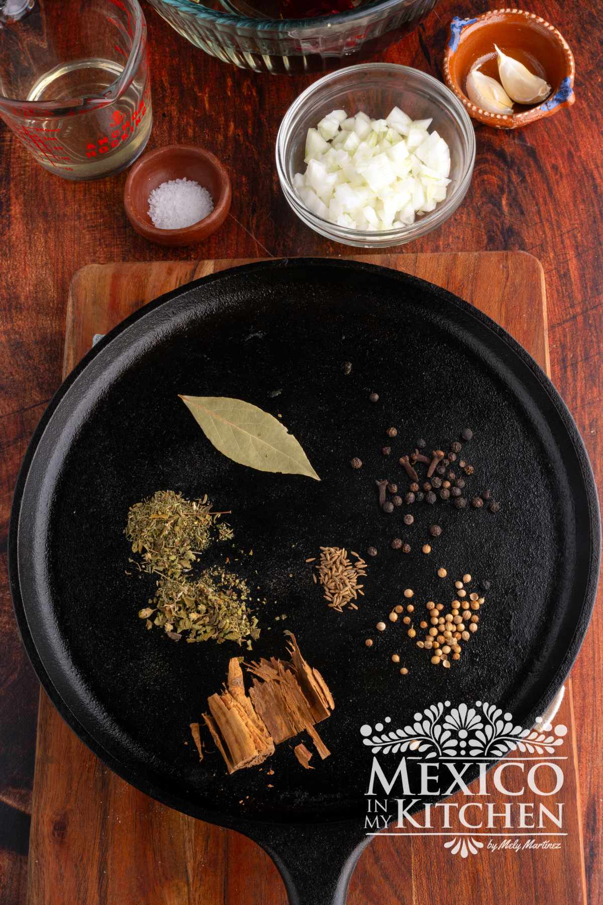 Spices being Toasted in a cast iron pan.