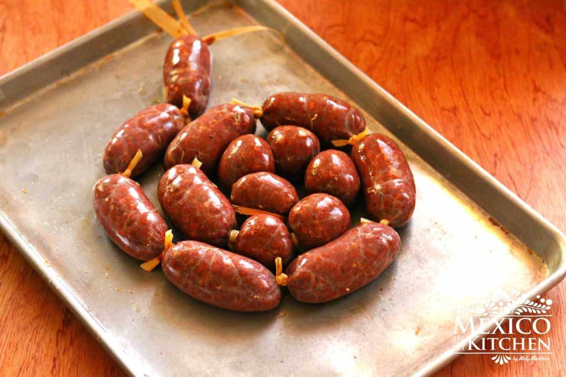 Mexican chorizo in casing, tied in medium-small sized links.